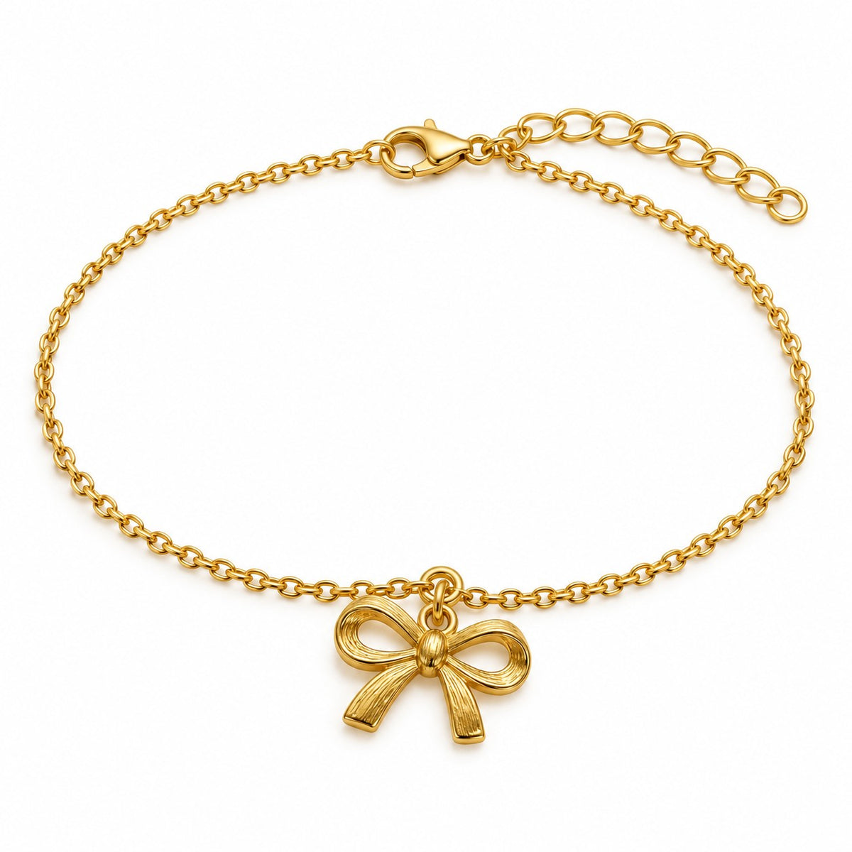 Gold bow charm bracelet with a ribbon bow charm on a white background