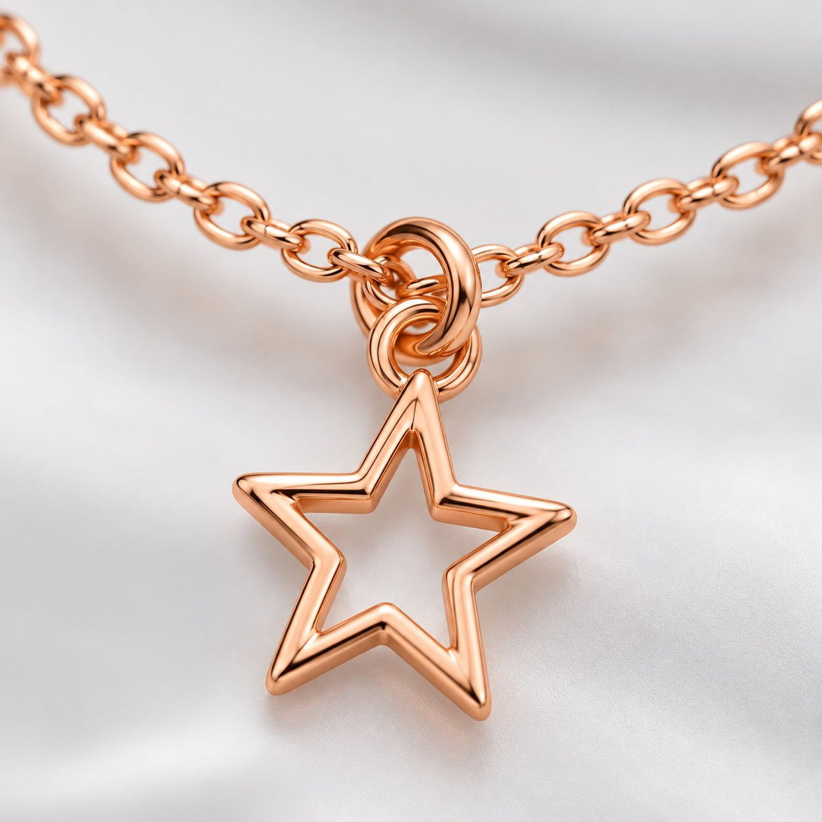 Close-up of the open star charm on the rose gold star charm bracelet