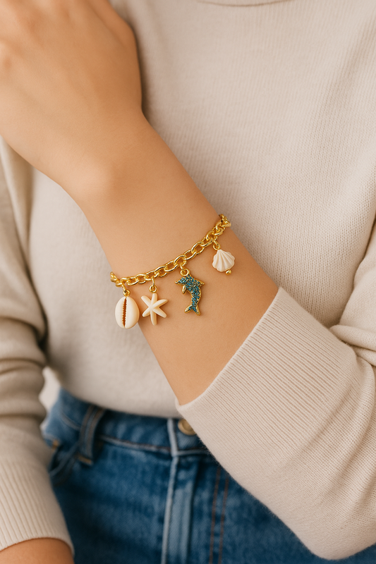 GlowFinch Gold finish Ocean Charm Bracelet for Women | Dolphin, Shell & Starfish Charms
