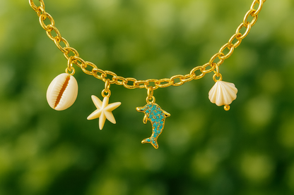 GlowFinch Gold finish Ocean Charm Bracelet for Women | Dolphin, Shell & Starfish Charms