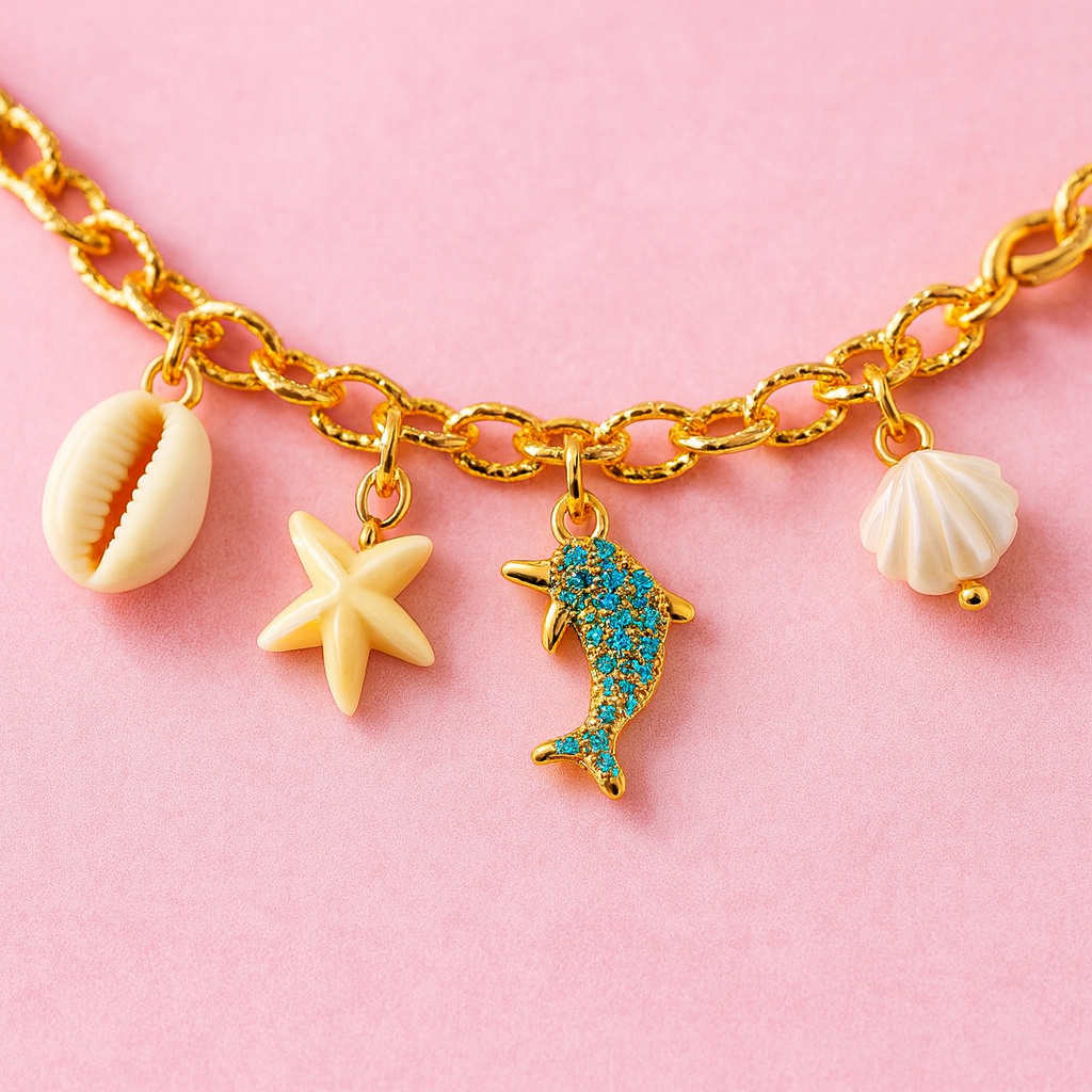 GlowFinch Gold finish Ocean Charm Bracelet for Women | Dolphin, Shell & Starfish Charms