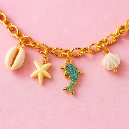GlowFinch Gold finish Ocean Charm Bracelet for Women | Dolphin, Shell & Starfish Charms