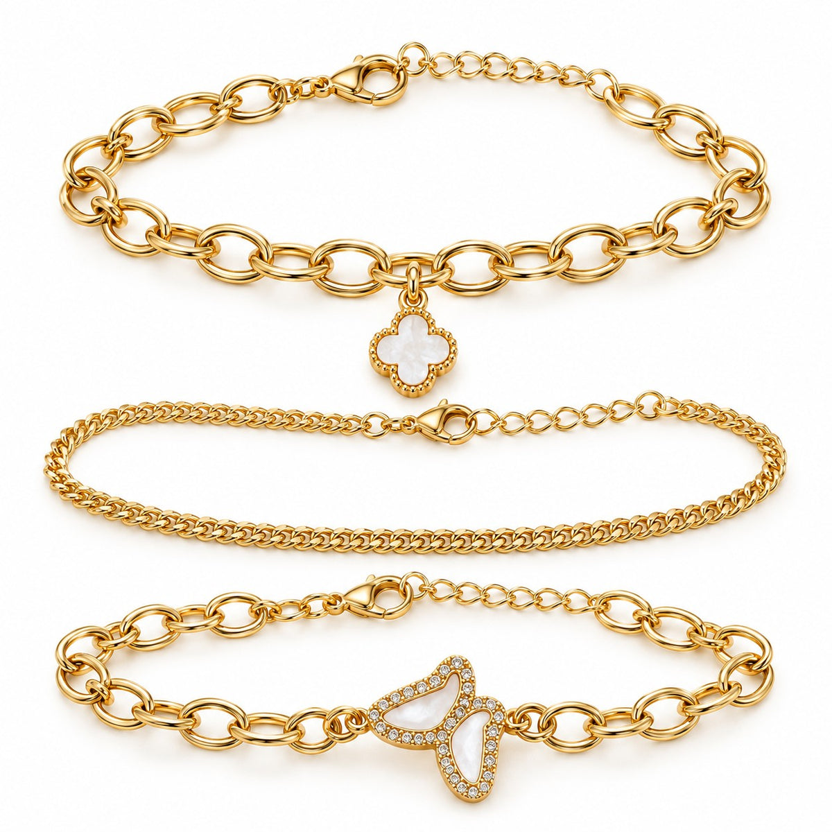 Gold clover and butterfly bracelet set of 3 laid out on a white background