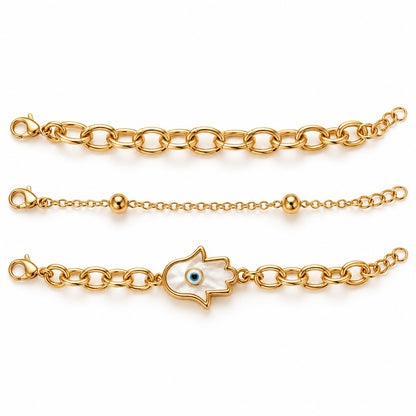 Gold hamsa evil eye bracelet set of 3 laid side by side on a white background