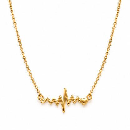Gold heartbeat pendant chain necklace for women on a white background