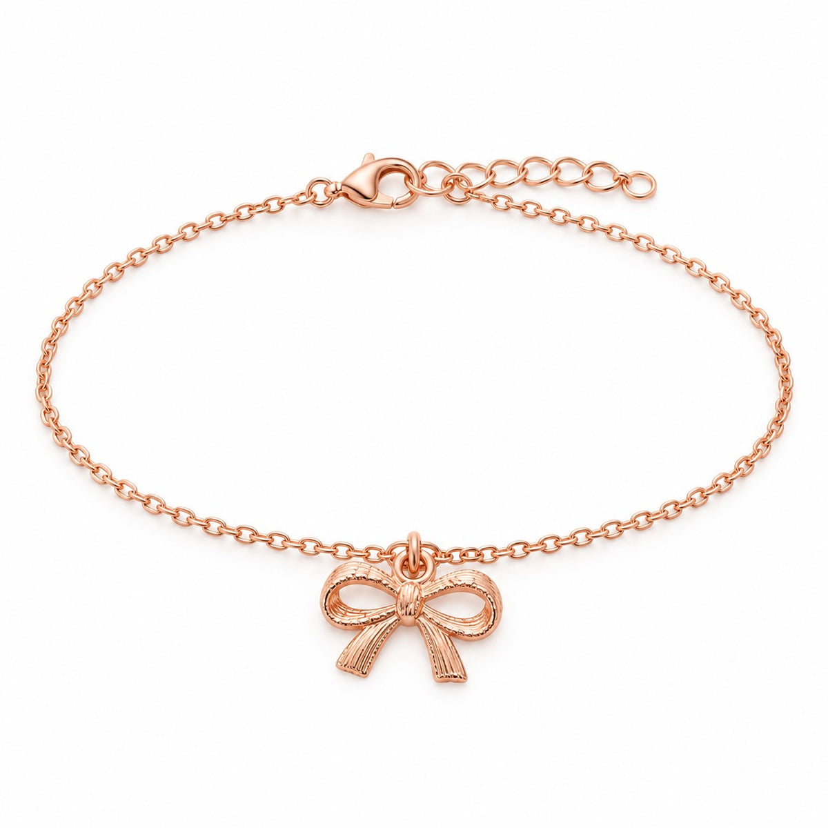 Rose gold bow charm bracelet with a ribbon bow charm on a white background