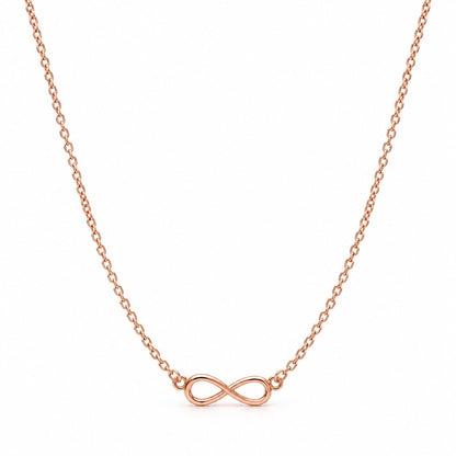 Rose gold infinity pendant chain necklace with sideways infinity on a white background