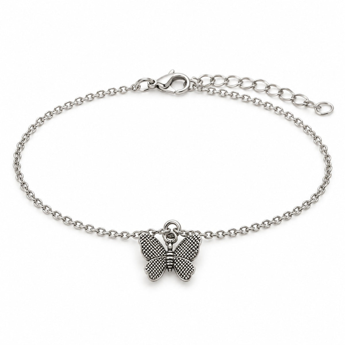 Silver butterfly charm bracelet with a textured butterfly charm on a white background