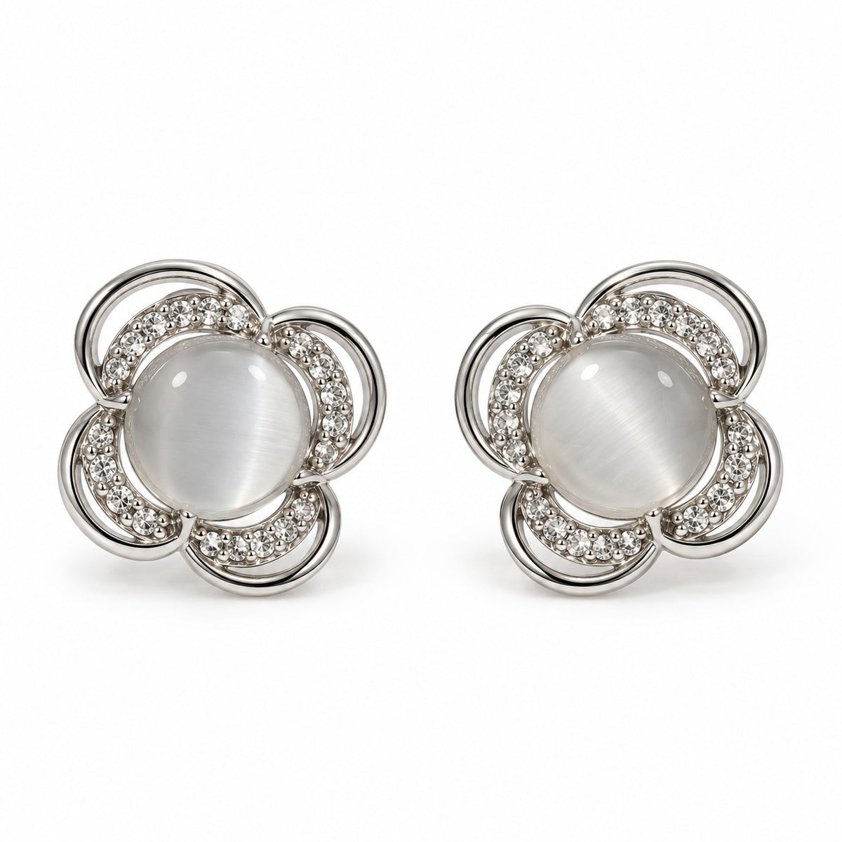 Silver flower cat eye stone stud earrings for women on a white background