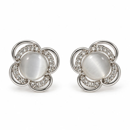 Silver flower cat eye stone stud earrings for women on a white background