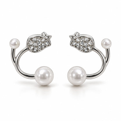Silver pearl open hoop stud earrings with crystal leaf top on a white background
