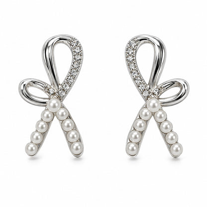 Silver pearl ribbon bow stud earrings for women on a white background
